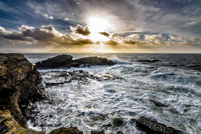 Ocean with clouds and sun